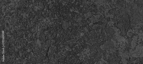Foto Natural weathered stone surface with dark grey mineral grains and rocky texture