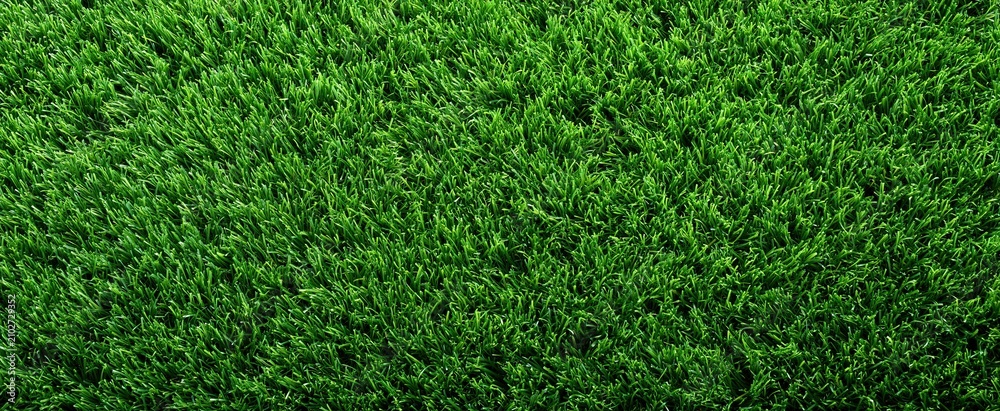 Obraz premium Synthetic bright green turf viewed from above, highlighting uniform texture and vibrant color for sports use.