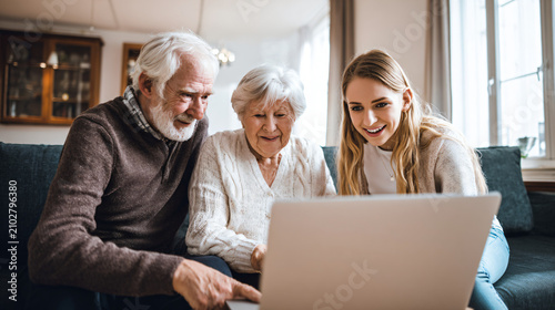 Ultra realistic multigenerational family participating in an online healthcare consultation using a laptop with a blank screen,