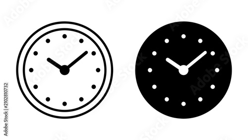Billede på lærred Two Clocks: A pair of simple, minimalist clocks, one in outline and one in solid silhouette, represent the concept of time