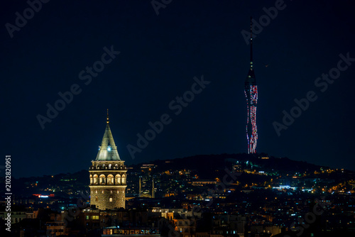 Historic Galata Tower and Modern Camlica Tower Over the Night Skyline of Istanbul, Turkey