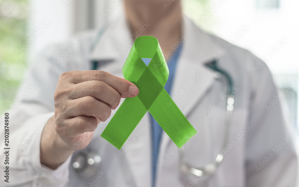 Fototapeta premium Lime green ribbon for awareness on Mental health illness, Lymphoma Cancer, Lyme Disease, Spinal Cord Injuries, Kabuki Syndrome, Duchenne Muscular Dystrophy, Sexually Transmitted diseases