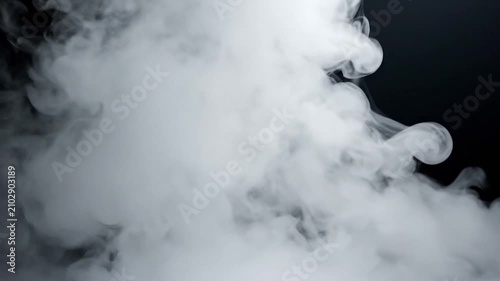White smoke swirls rise against a solid black background