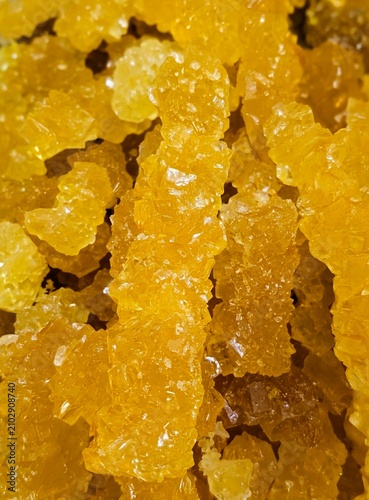 navat, crystallized sugar candy with amber-colored crystals, macro close up