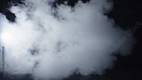 A fluffy white cloud floats against a solid black background