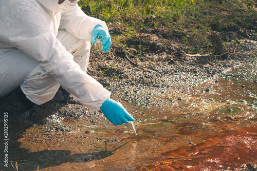 Environmental scientist collecting and analyzing water samples to ensure clean water quality.