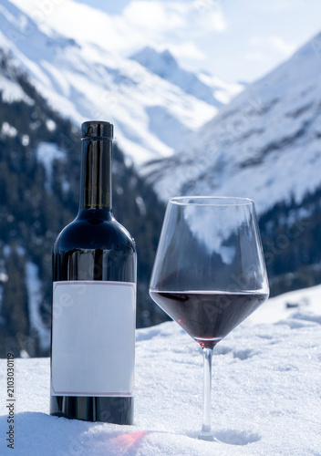 glass of wine and a bottle