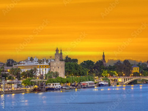 Stunning sunset over the old town of Seville on the shores of the Guadalquivir river,  Andalusia, Spain