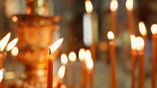 Burning Church Candles with Soft Bokeh Background, Slow Horizontal Camera Slide.