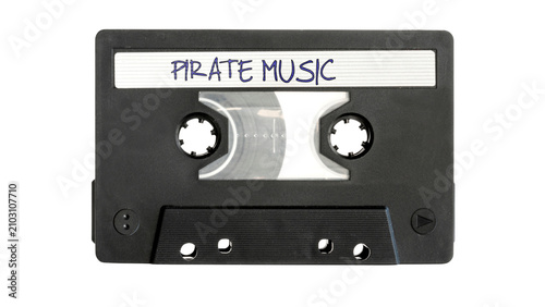 Obraz na płótnie Retro Audio Cassette Tape with Pirate Music Label Isolated on White Background