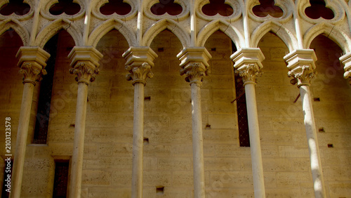 Gothic columns, arches and architectural details inside Notre-Dame Cathedral in Paris.