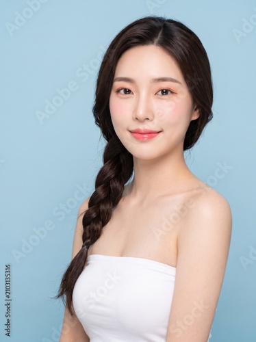 young woman with long dark braided hairstyle