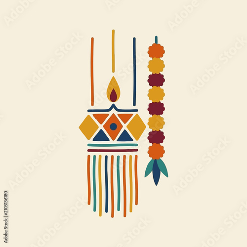 Colorful traditional Indian oil lamp with marigold garland