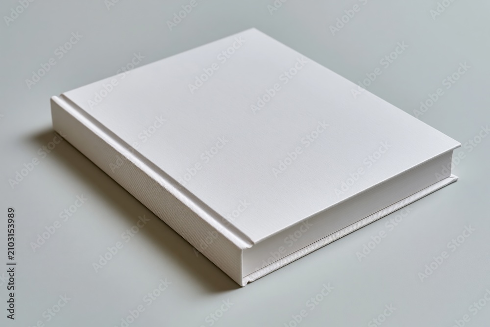 Fototapeta premium The White Blank Book: A Minimal Still Life on a Quiet Desk