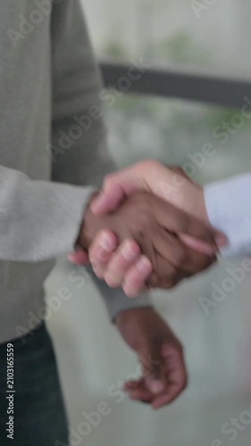 Slow Motion of Mixed Race Businessmen Shaking Hands, Vertical Video
