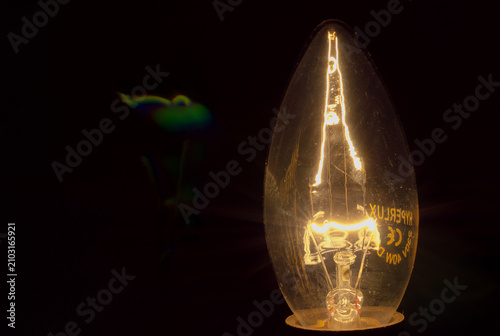 Near view of a lluminous bulb in the dark