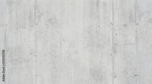 Minimalist light gray concrete wall texture for modern design. Smooth industrial surface background with subtle grain and neutral tones.
