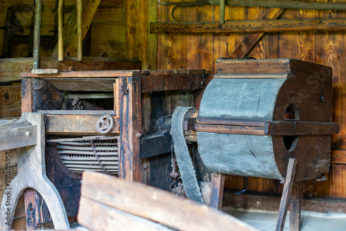 Εκτύπωση καμβά Close-up of an antique wooden agricultural machine for cleaning grain, featuring