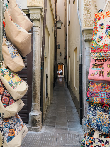 Fotografie Bags Displayed for Sale in Narrow European Alleyway