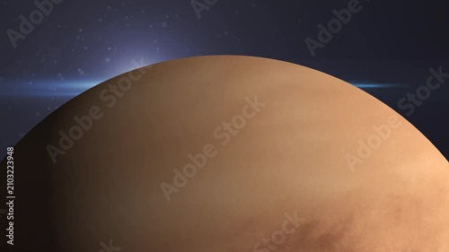 Planet Venus in deep space. Cinematic view of the planet surface with glowing atmosphere.