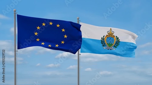 The European Union and San Marino flags waving against a blue sky