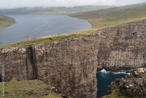 Scenic view of Sorvagsvatn Lake and Traelanipa Cliffs with Village View, Faroe Islands