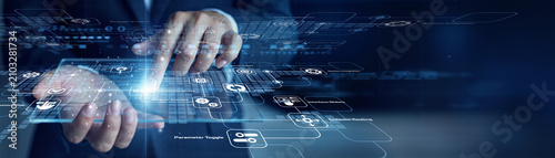 Photography Software head developer handholds virtual screen displaying futuristic data and touches API (Integration) system controls for advanced optimization