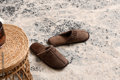 Pair of brown suede slipper...