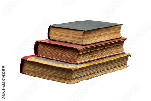Fotografie Stack of three old weathered vintage books isolated on a white back