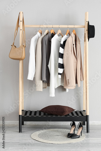 Wooden clothes rack with a ...