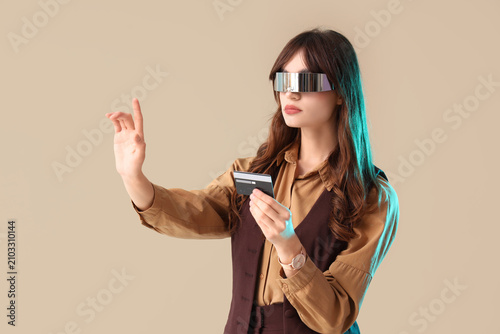 Young businesswoman in AR g...