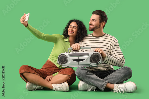 Young couple with boombox t...