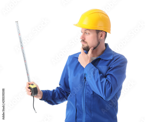 Thoughtful male builder wit...