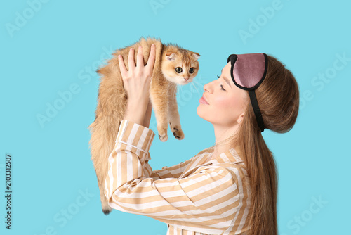 Young woman in pajamas with...
