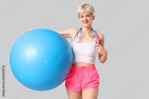 Sporty young woman with fit...