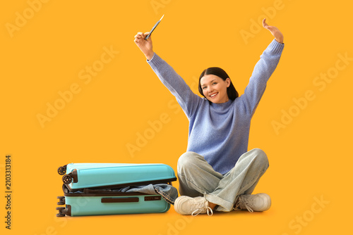 Happy young woman with pass...