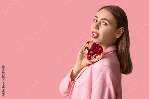 Young woman with pomegranat...