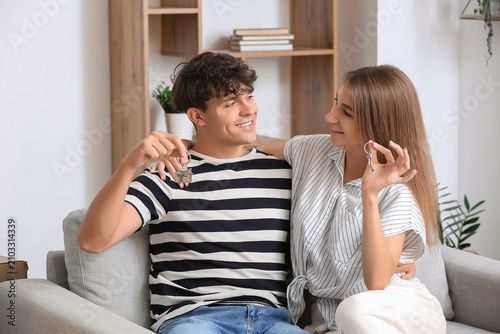 Young couple with keys in t...