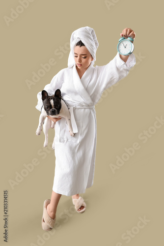 Young woman in bathrobe wit...