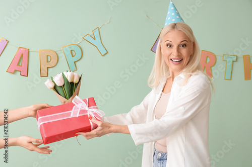 Mature woman receiving birt...