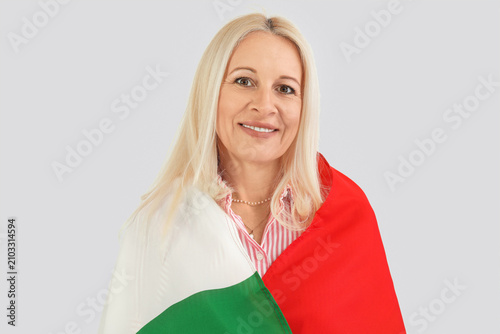 Mature woman with flag of I...