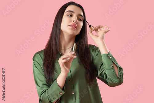 Pretty young woman applying...