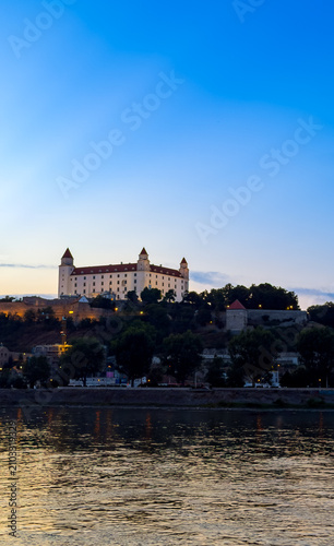 Photography Bratislava Castle shines in evening sky