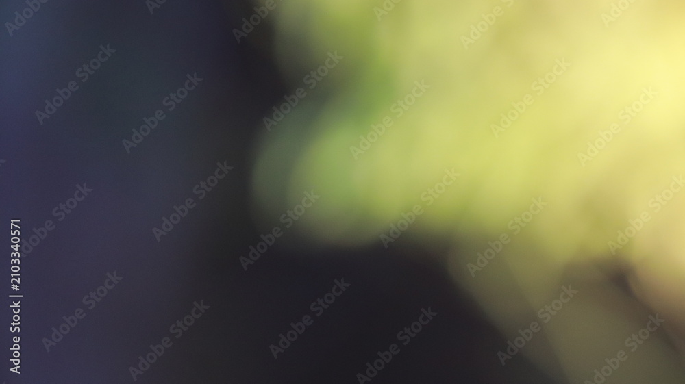 Obraz premium Abstract soft yellow bokeh light on dark purple background texture for design projects