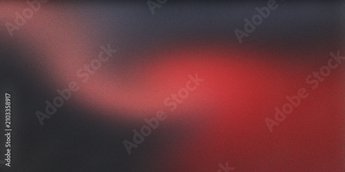 Fotografie Vibrant abstract grainy texture background with dark gray and fiery red gradient colors creating a dynamic, blurry light leak effect
