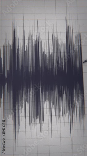 Seismograph Record of an Earthquake on old paper. Hd 3d animation video showing a close-up shot of the seismograph pen	in vertical format 
