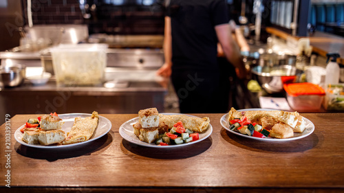 Dishes prepared and served at a busy kitchen during lunch hour