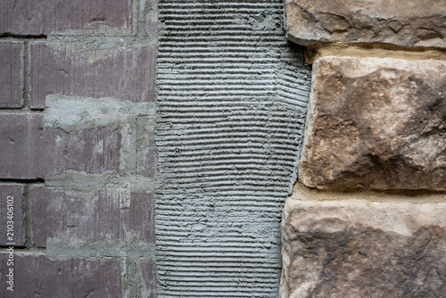 Photography Stone Veneer Installation Process - Masonry Wall Construction Close Up