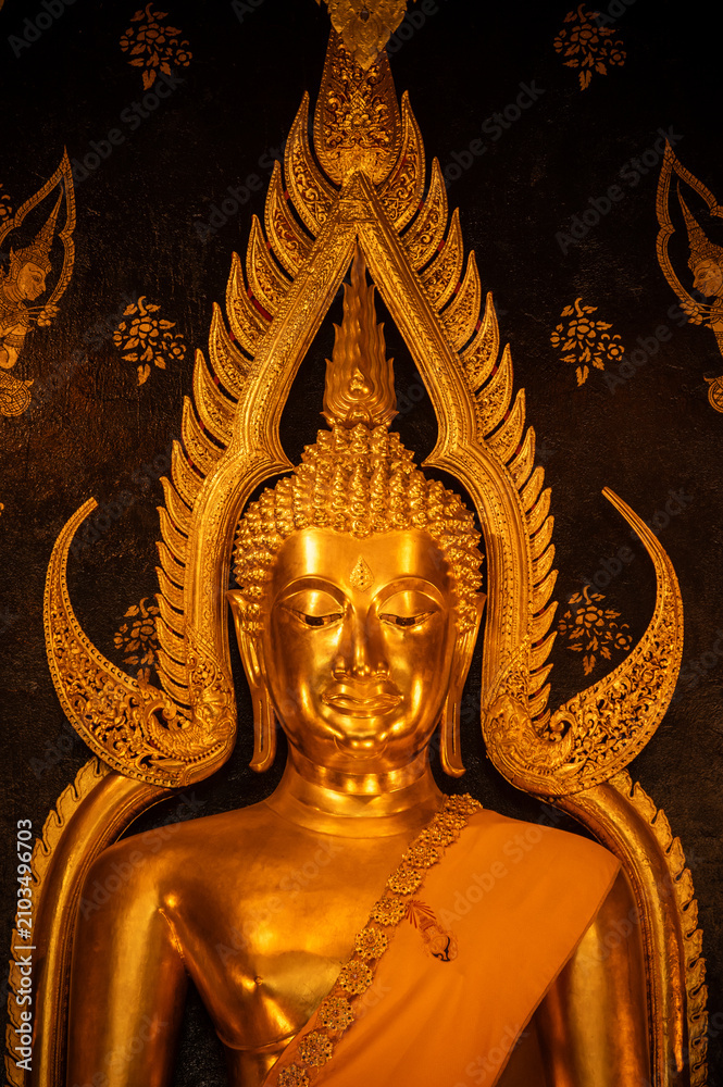 Fototapeta premium Close up of beautiful golden Buddha situated in Wat Phra Sri Rattana Mahathat temple in Phitsanulok province of Thailand.