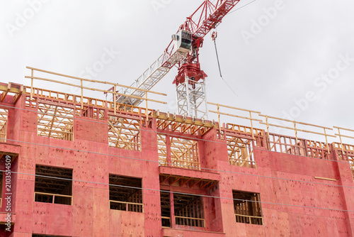 
A multifamily residential building under construction utilizing fire retardant treated wood (FRTW) for its framing and sheathing. 
